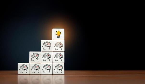 Wooden cube block with head human symbol and light bulb icon. Teamwork it's an easy way to resolve problem. photo