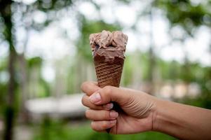 Hand pictures and chocolate ice cream, food concept with copy space photo