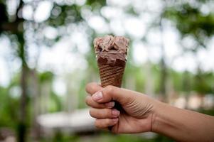 Hand pictures and chocolate ice cream, food concept with copy space photo