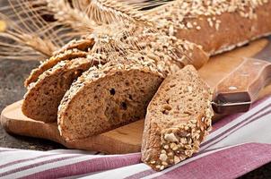 Slices of finest organic bread decorated with natural cereals photo