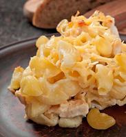 Macaroni with cheese, chicken and mushrooms baked in the oven photo