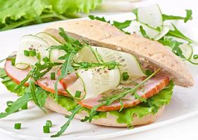 Useful sandwich with ham and herbs photo