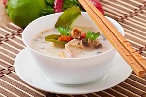 Thai soup with chicken and mushrooms photo