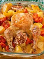 Baked chicken with potatoes photo