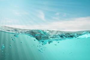 blue sea waves stopped steaming with separate bubbles on a white background. Popular corners, natural concepts photo