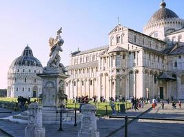 PISA, ITALY, 2021 - View to the Pisa Baptistery and Cathedral of Pisa. Square of Miracles, Cathedral Square photo