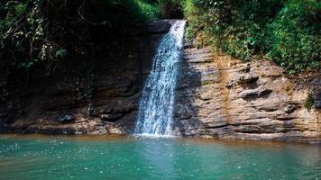 beutiful waterfall with torquose water photo