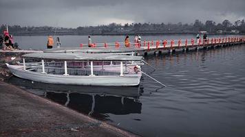 landscape boat by lake and bridge photo