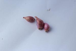 fresh red onion shallot Bawang Merah isolated on white background and healthy ,Selective Focus. photo