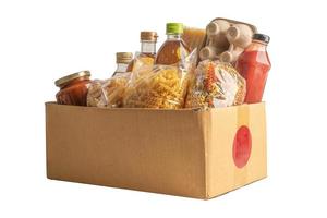 alimentos para donación, almacenamiento y entrega. varios alimentos, pasta, aceite de cocina y alimentos enlatados en caja de cartón. foto