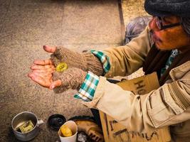 A poor homeless man are shocked to receive donations as bitcoin photo