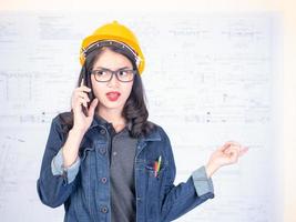 Female engineers are calling to talk about construction work photo