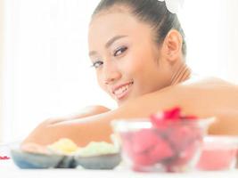 Young asian beautiful woman relaxing in spa salon photo