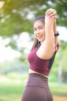 Beautiful Asian women exercise in the park every morning, It is a lifestyle for relaxation and good health of the body photo