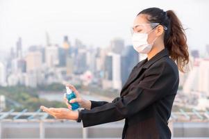 Asian women have to use masks and goggles to protect against pollution from dust and prevent the infection from viruses photo