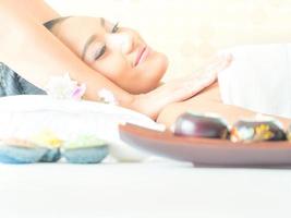 Young asian beautiful woman relaxing in spa salon photo