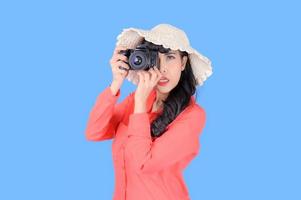 Beautiful and charming women dress in a retro style, Take a film camera to take pictures