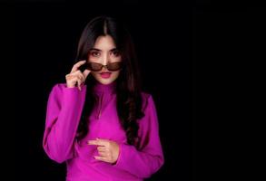 Beautiful and charming women in retro style dresses, Standing in the studio holding sunglasses to take pictures photo