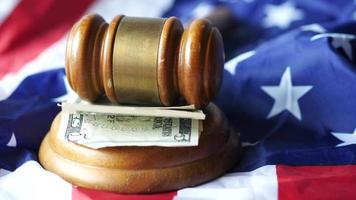 a gavel and us dollar cash on a american flag video