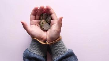 child girl pile coin for saving. sitting on floor video