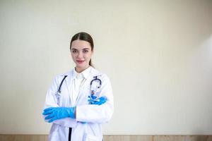 Smart woman doctor with stethoscope and gloves photo