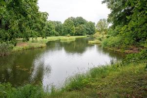 Park with lake in the sun photo