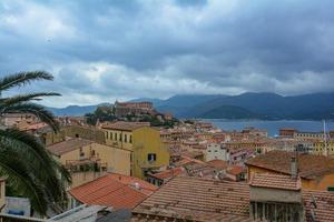 Scenery of houses in Portoferraio, Italy on a cloudy day photo