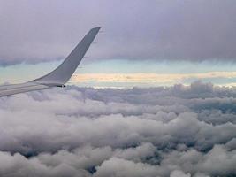 Part of airplane in the clouds photo