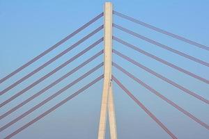 pylon bridge over blue sky photo