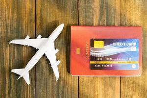 Credit card put on passport on wooden table photo