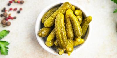 gherkins cucumber salted pickled vegetable food meal snack on the table photo