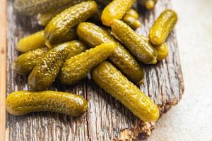 gherkins cucumber salted pickled vegetable food meal snack on the table photo