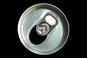 Open-lid beverage cans with water droplets on top on a black background