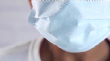 Close up of man with protective face mask taking deep breath video