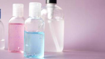 hand sanitizers on wooden table, Close up video