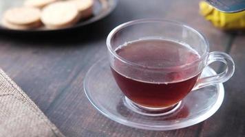 pouring condensed milk in cup of tea video