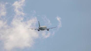 Airliner flies away, back view video