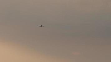 Airplane at sunset, long shot video