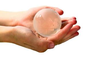 glass globe is in hands photo