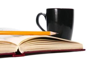 book is a cup and pencil photo