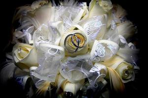 wedding rings and bouquet photo