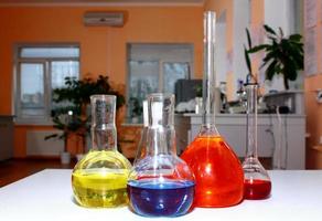 laboratory beakers with the coloured liquid photo