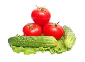 tomatoes and cucumbers on  lettuce photo
