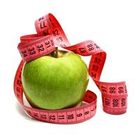 measuring ribbon and apple for diet photo