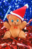 toy bear in the hat of santa claus photo