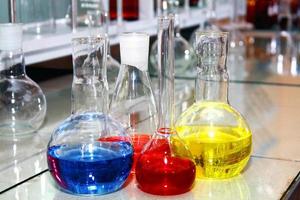 laboratory beakers with the coloured liquid photo