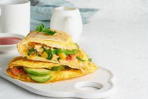 Trendy breakfast with quesadilla and eggs, trending food with omelet, cheese photo