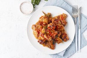 Barbecue chicken wings. Oven baked chiken on plate. Hot korean food. Top view, copy space photo