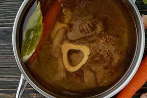 Paleo bone broth diet, beef meat soup. Low-carb food, keto recipe. photo