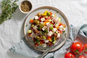 Greek village salad horiatiki with feta cheese and vegetables, mediterranean food photo